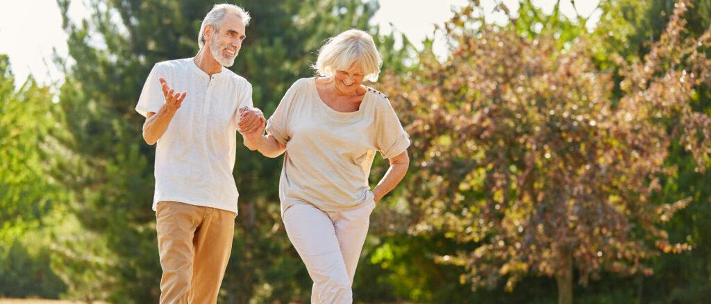 Couple,In,Love,Holding,Hands,On,A,Walk,In,The